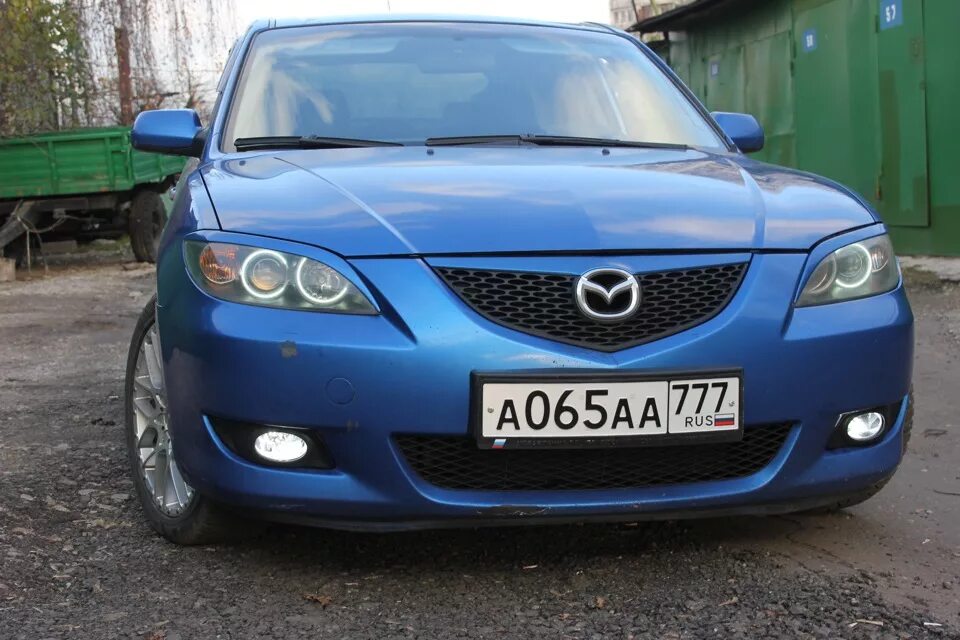 Мазда 3 бк 2006 год. Mazda 3 2008 г. ПТФ. Mazda 3 BK ПТФ. Mazda 3 2008 хэтчбек ПТФ. Mazda 3 Axela 2004 ПТФ.