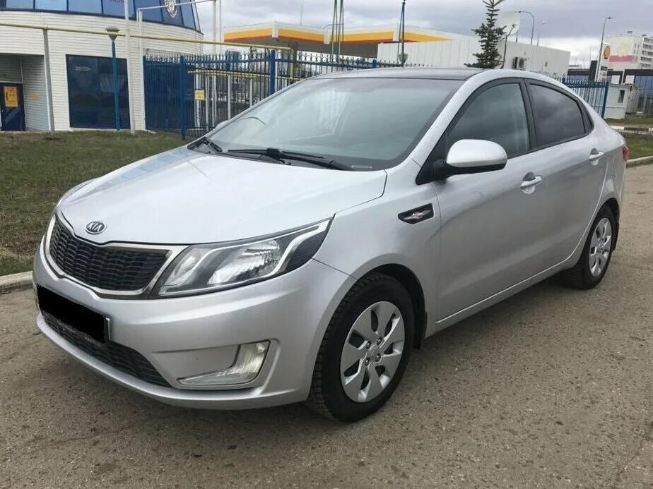 Кия рио 2012 год. Kia Rio III 2012. Kia Rio 2012 1,4. Kia Rio 2012 Silver. Киа Рио 2012 седан серебристый металлик.