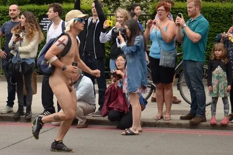 30 Clothed women taking pics of naked male 
