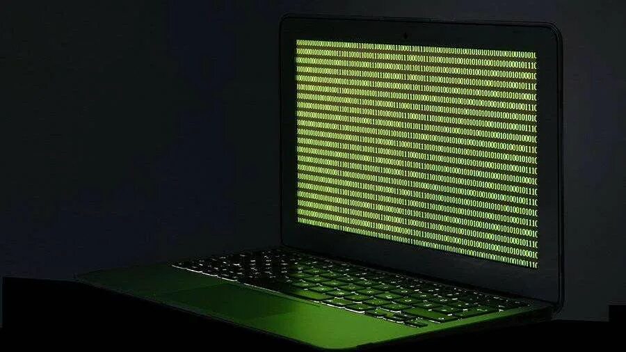 Password cracking. взлом ноутбука. взлом компьютера. хакер в капюшоне за ноутбуком. Laptop взлома.