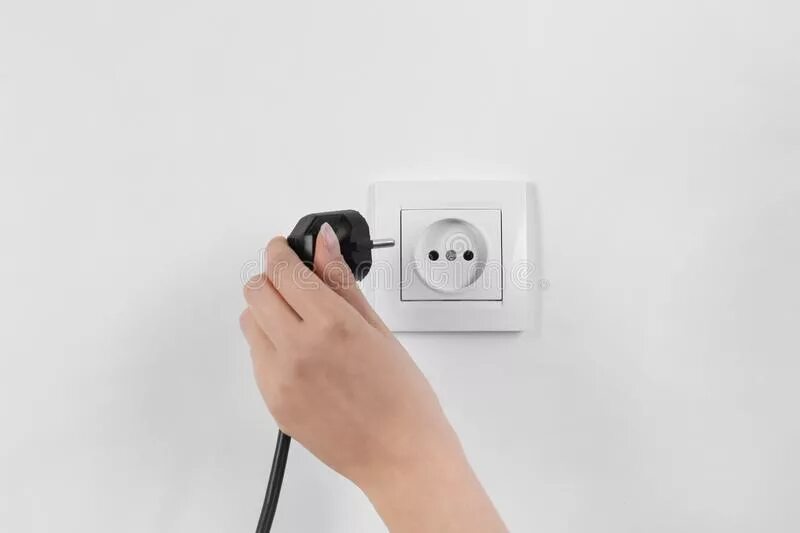 Putting plug. Put plug. The picture of an iphone plugged into electric socket. Искры из розетки. Putting plug.