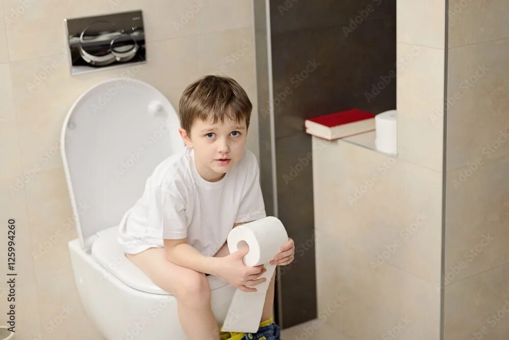 Little 7 Years Old Boy Sitting on Toilet. Stock Image - Image of baby, lavatory: