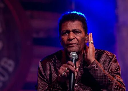 Country star Charley Pride singingin. 