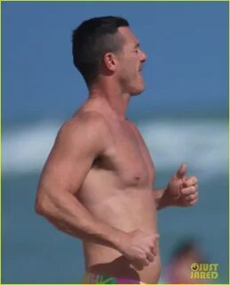luke evans shows off nipple piercings while shirtless in miami 073536002. 
