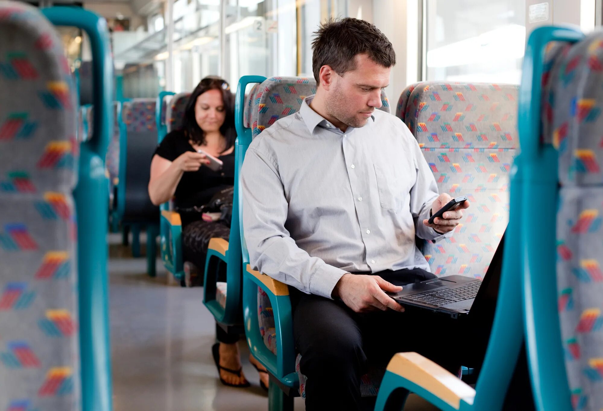 They go to work by bus. Человек сидит в автобусе. Люди в автобусе. Парень едет в автобусе. Мужчина в автобусе.