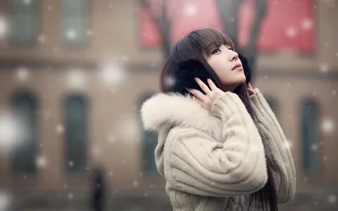 Beautiful Asian Girl in Snow Fall HD Wallpaper.