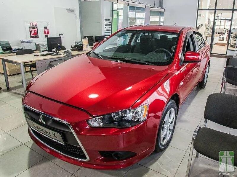 Купить мицубиси новый у дилера. Mitsubishi Lancer 10 Рестайлинг красный цвет. Mitsubishi Lancer 1.6 2014 автомат. Автосалон Mitsubishi. Красный автосалон.