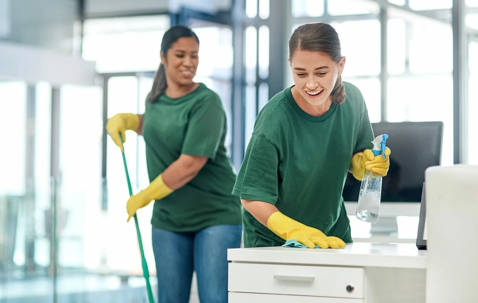 Advantage of hiring a Cleaning Company. Cleaning Mind. Woman cleans Office. Helping out by keeping the Floor by her Desk clean..