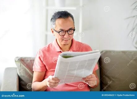 He was reading newspaper