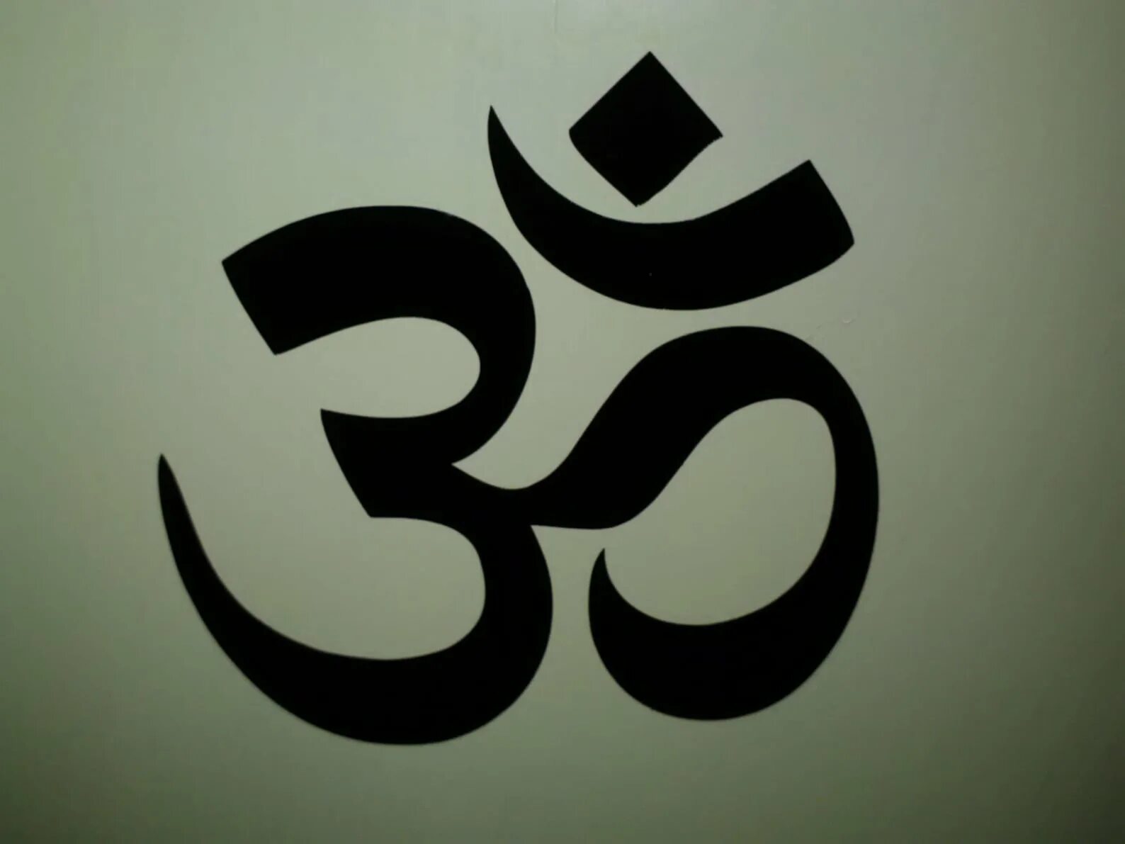 Санскритский символ ом. Символ ом значение. Знак ом значение. Индуистский символ аум. Знак ом на санскрите.