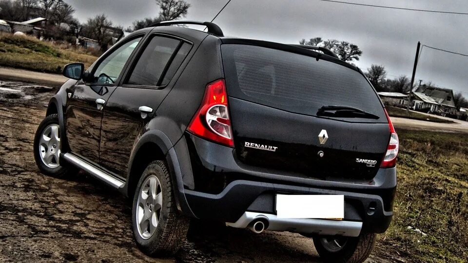 Sandero stepway 2012. Рено Сандеро степвей 2012. Рено Сандеро степвей черный 2012. Renault Sandero Stepway 2012. Рено Сандеро степвей 2011 года.