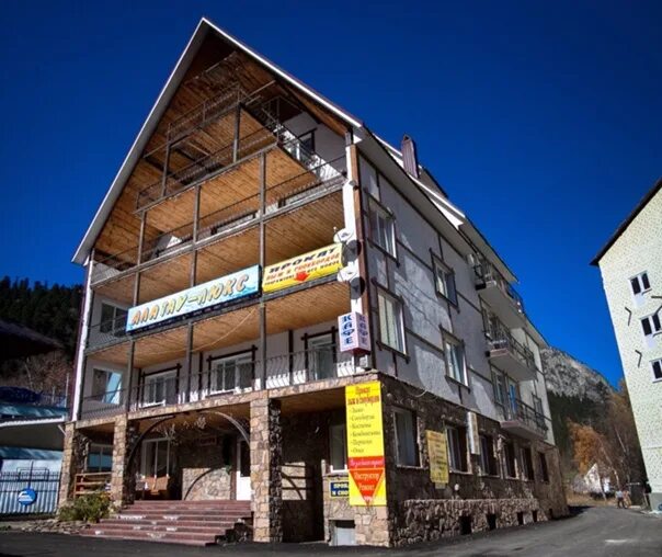 Гостиница элия домбай. Гостиница алатау домбай. Домбай алатау люкс гостиница. Домбай алатау люкс гостиница. Алатау домбай гостиница официальный сайт.