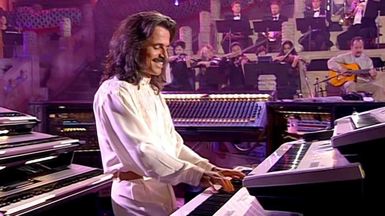 Янни хрисомаллис концерт. Янни хрисомаллис шторм. Оркестр янни хрисомаллис. Yanni Tribute.