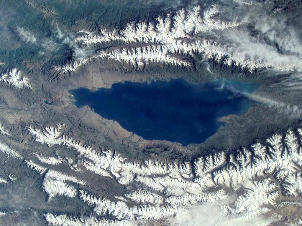 The world deepest lake is lake. Озеро Иссык-Куль из космоса. Озеро Иссык-Куль вид из космоса. Озеро Иссык-Куль снимок из космоса. Озеро Иссык-Куль Киргизия вид с космоса.