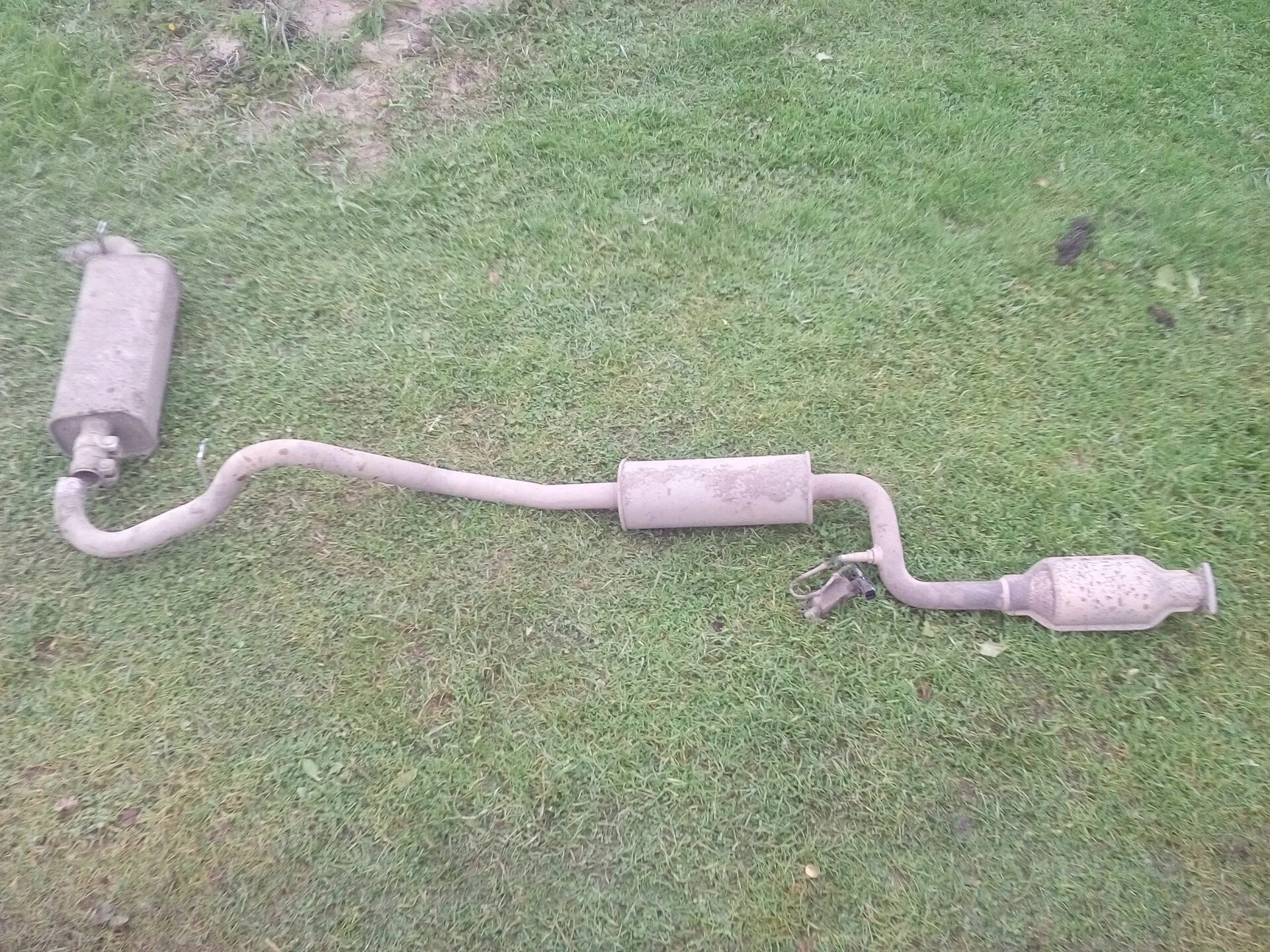 Глушитель ваз 2123 niva chevrolet. Глушитель chevrolet niva. Выхлопная система нива шевроле оригинал. Глушитель на ниву шевроле 2010. Выхлопная нива шевроле.