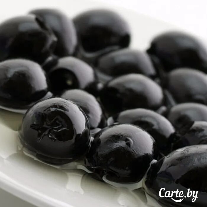 Польза косточек маслин. Огромная маслина. Маслины черные. Крупные черные маслины с косточкой. Маслины крупные без косточки.
