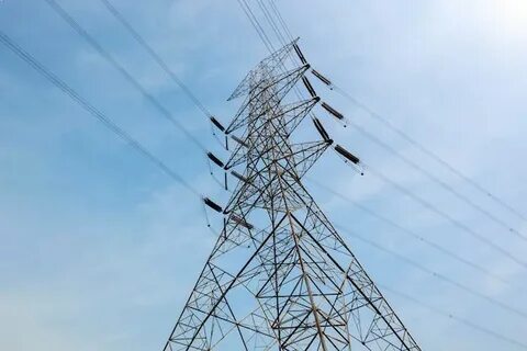 Premium Photo Close up bottom view electricity overhead power lines on sunset sk