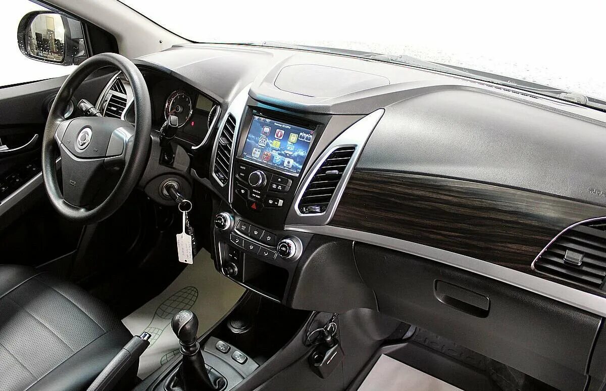 Ssangyong new actyon 2013. SSANGYONG Actyon 2013. Санг Йонг Актион 2013. Саньенг Актион 2014 панель.