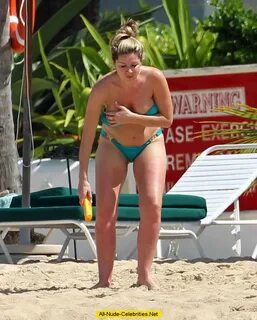 Claire Sweeney sexy in blue bikini on the beach in Caribbean.