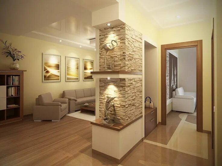 A stone wall beautifully complements the design of a living room. You can see th