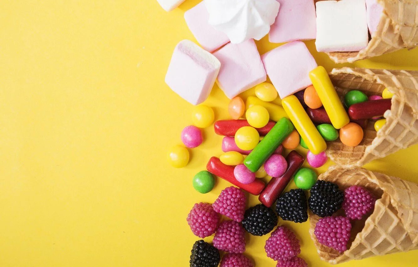 Разные вкусняшки. Фон сладости. Разноцветные конфеты сладости. Сладость в радость. А4 со сладостями.