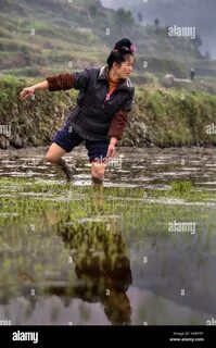 Xijiang miao village, Guizhou Province, China - april 18, 2010: Young Asian ...