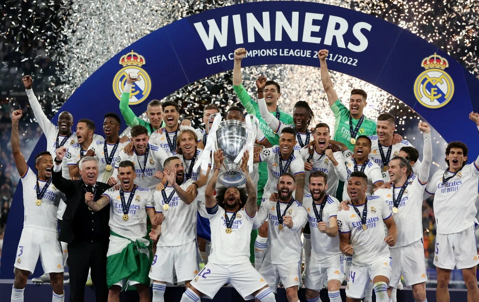 Реал победитель Лиги чемпионов 2022. Реал Мадрид победитель Лиги чемпионов 2022. Реал Мадрид лига чемпионов 2022. Реал Мадрид чемпион 2022. Футбольные турниры лига чемпионов