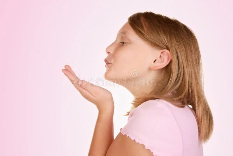 Blowing a kiss. Blowing a kiss