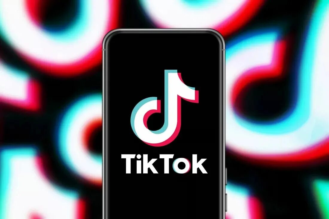 Тикток. Новый тикток. Символ тик тока. Тик ток на экране телефона. E tiktok фото.