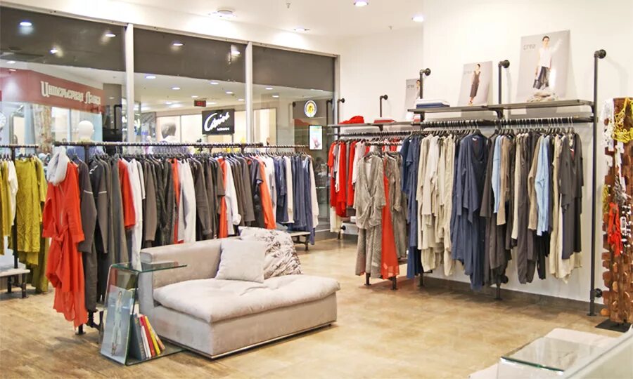 Торговое оборудование для магазина женской одежды. Одежда из бутиков. Shop in shop одежда. Отдел женской одежды. В модном магазине.