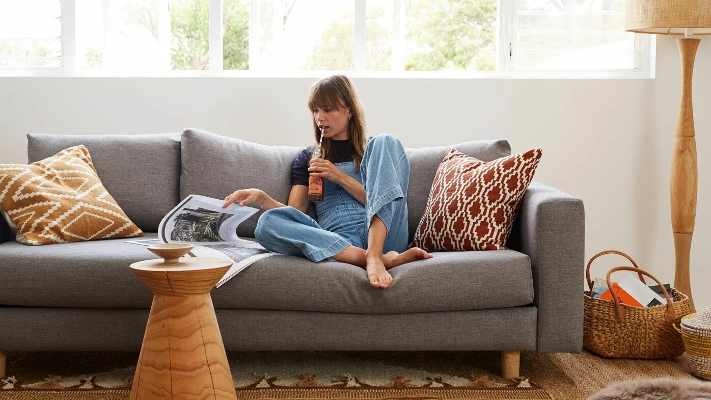 There are two sofas in the room. Диван people. Sitting on the Living Room Sofa. Наслаждение на диване. Women on Home Sofa.