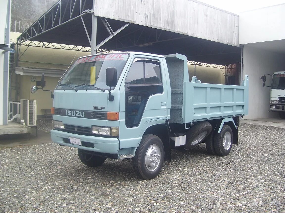 Дром грузовики самосвалы. Isuzu Elf 1990 грузовой самосвал. Isuzu Elf 4wd. Исудзу Эльф 4 ВД. Isuzu Elf 1992 2т.