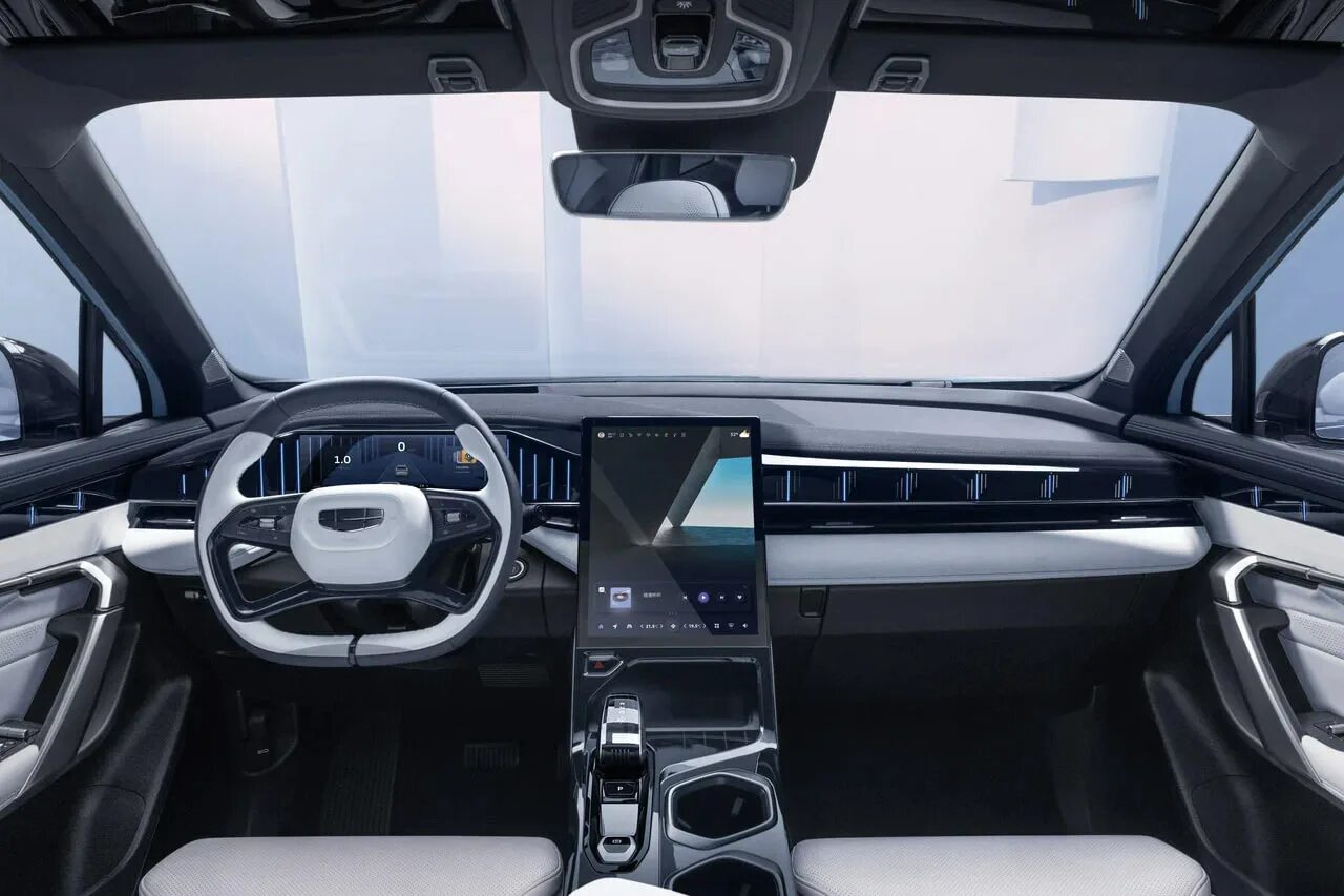 Geely atlas 2025 руль. Китайский кроссовер с телевизорами на заднем. китаец кроссовер 2025 года за 4 млн.