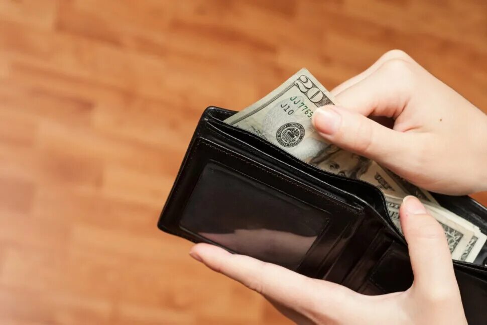 Your wallet is in the. Trust wallet кошелек деньги. мужчина держит бумажник. take the money from the wallet.. hot near wallet.