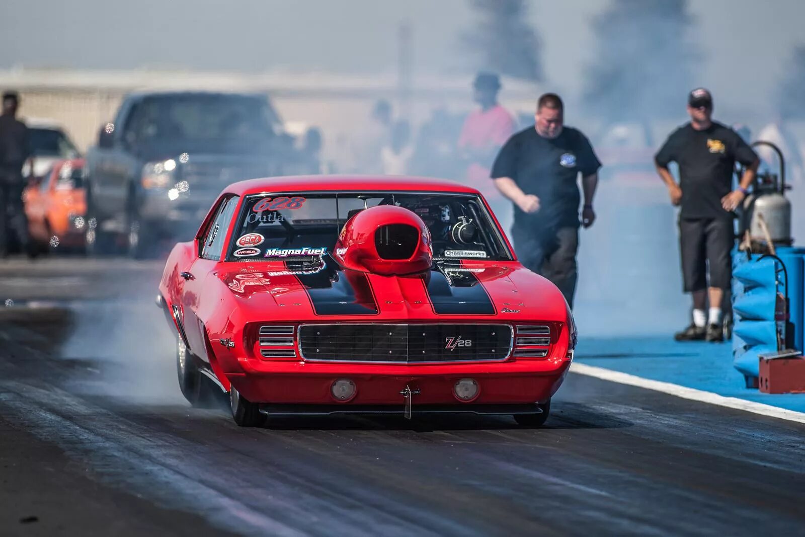 Ну гоняй. Драг рейсинг Chevrolet Camaro. Chevrolet Camaro 1986 Drag Racing. Форсаж драг рейсинг. Drag Racing уличные гонки фото.