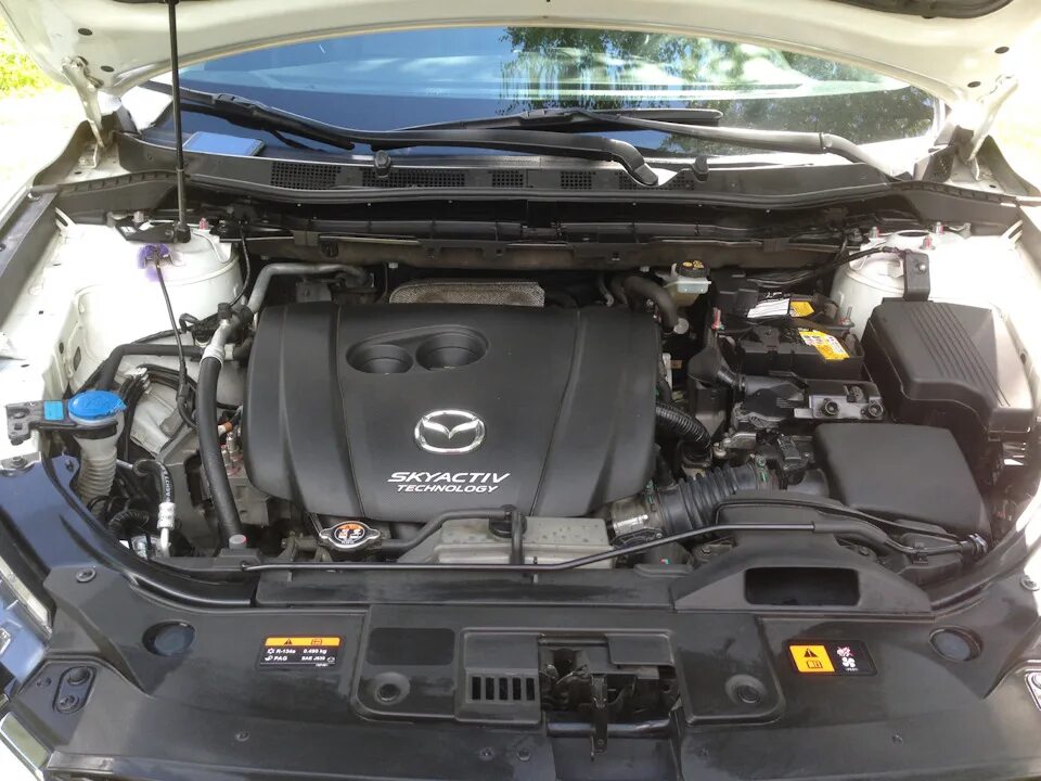 Капот мазда сх 5. Mazda CX 5 под капотом. Моторный отсек Мазда сх5. Под капотом Мазда сх9 2.5. Mazda 5 под капотом.