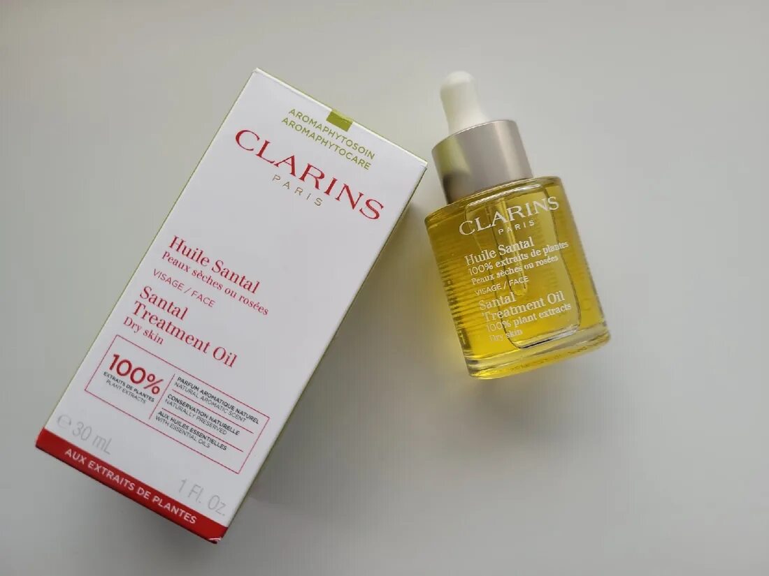 Масло кларанс для лица отзывы. Clarins масло santal. Масло от кларанс. Clarins oil 09. Кларинс треатмент ойл.