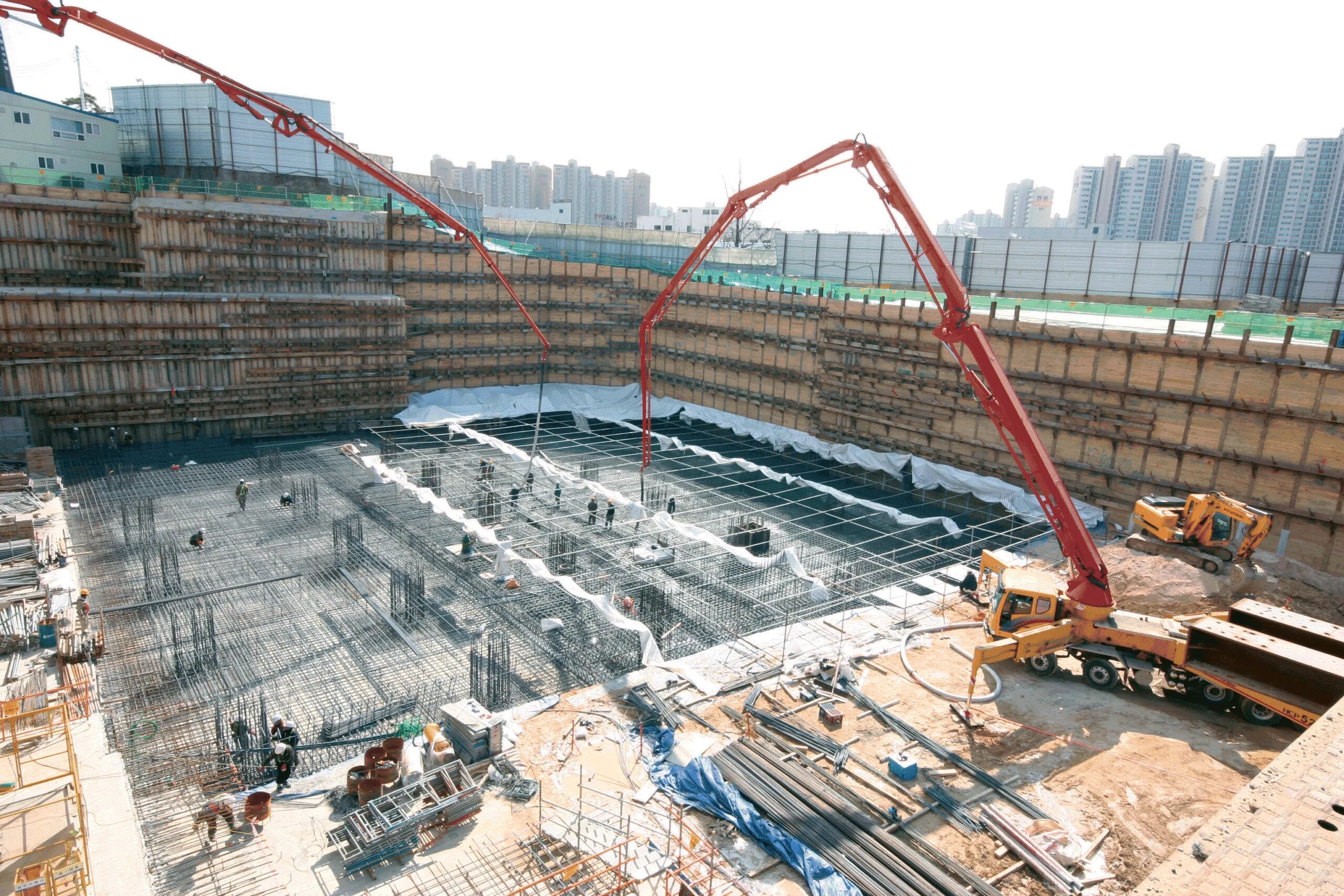 Фундамент здания. Фундамент здания. Монолитные жб колонны. Стройка здания фундамента. Фундамент высотки.