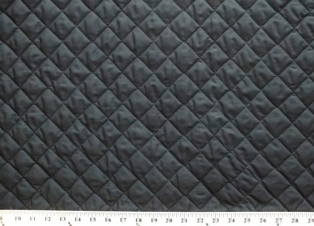 Текстура одеяла. Quilted fabric. Jacket texture. Quilted fabric. Padded cloth.