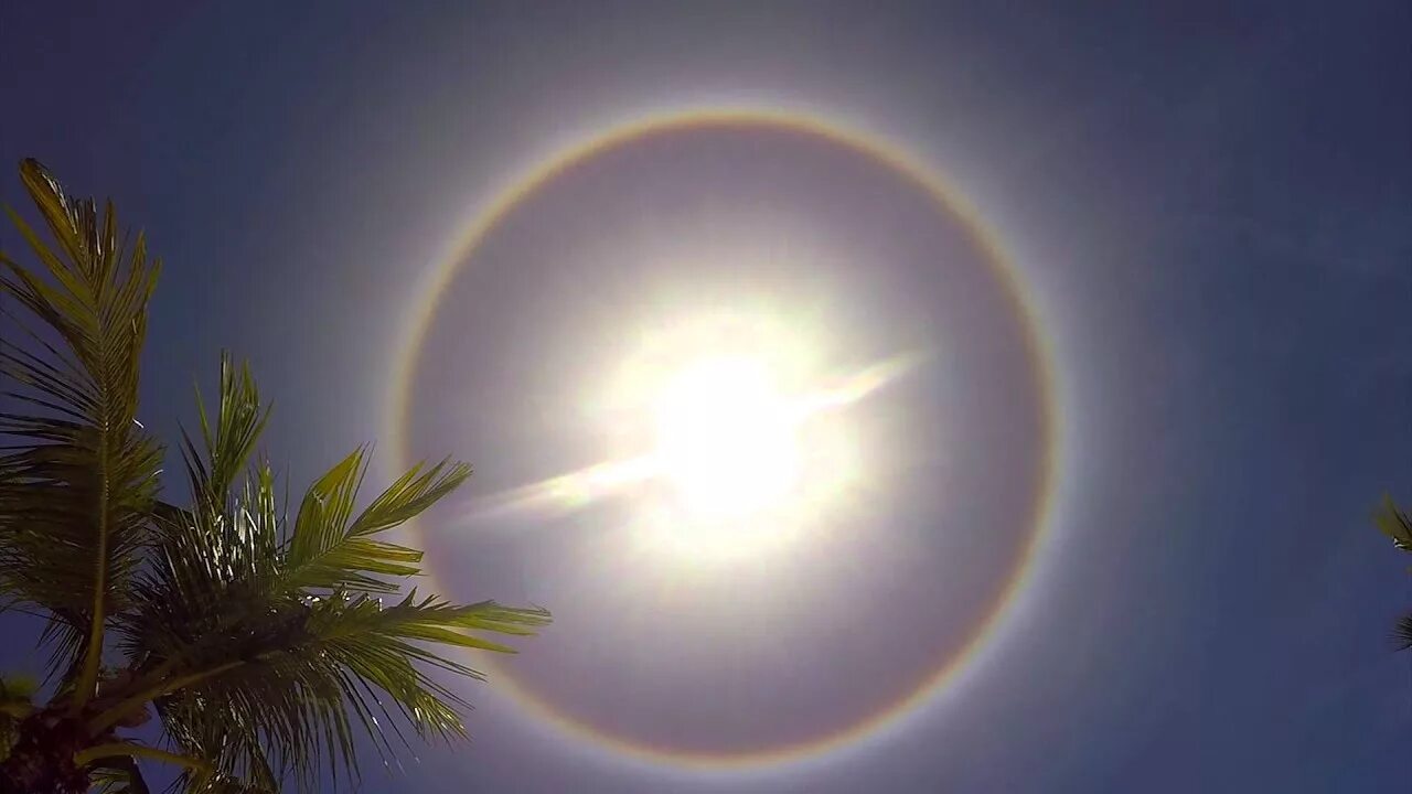 Sunny luminary. Halo around the Sun. Rainbow Halo. 8mm around the Sun. Sun Halo rare.