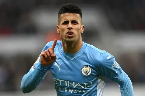 NEWCASTLE UPON TYNE, ENGLAND - DECEMBER 19: Joao Cancelo of Manchester City...