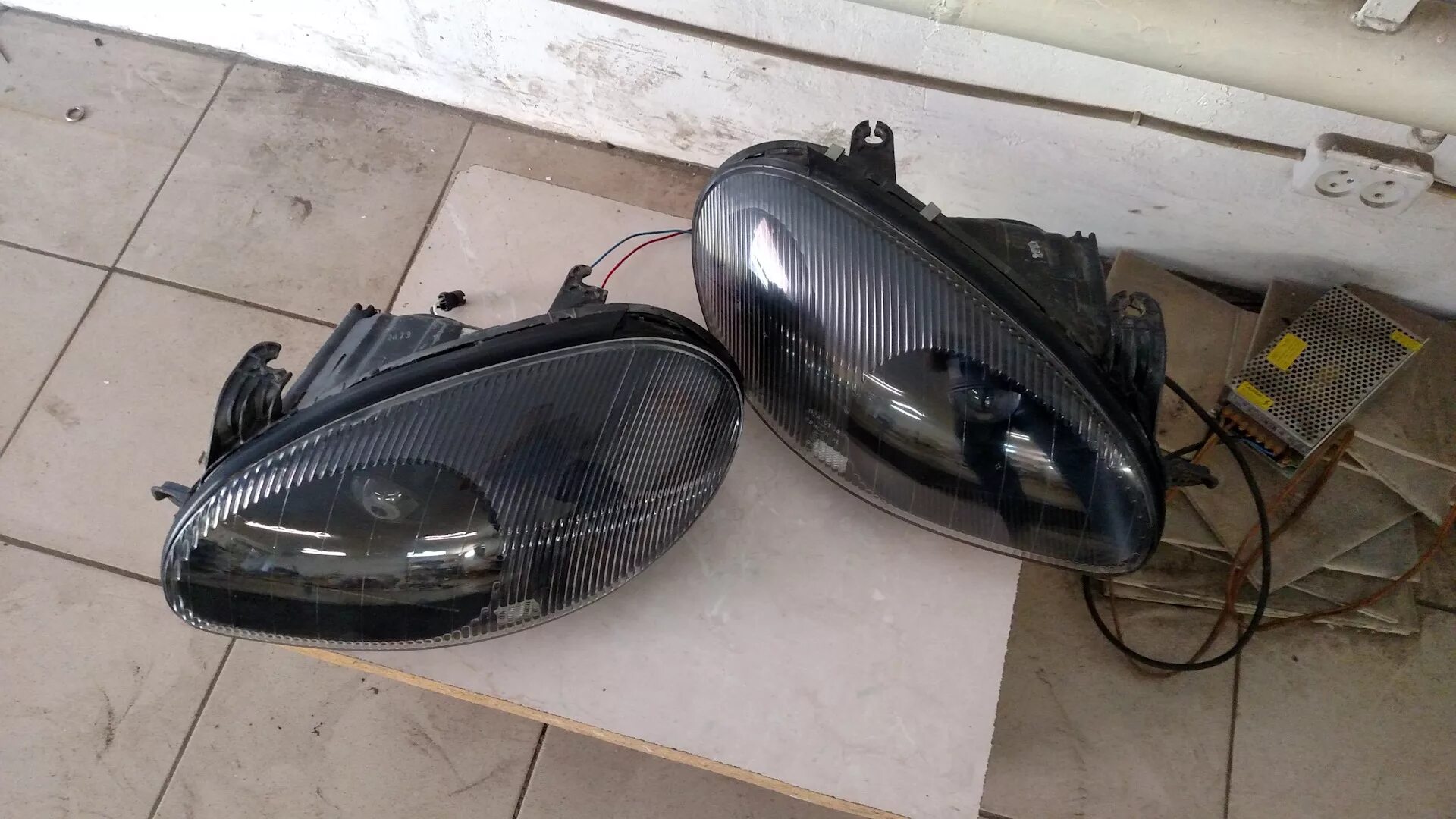 Chevrolet lanos фары. 1603174 фара на ланос. Ланос 1. Фара ланос с электрокорректором. Линзованные фары на шевроле ланос.