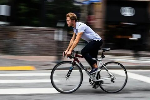 He s riding a bike