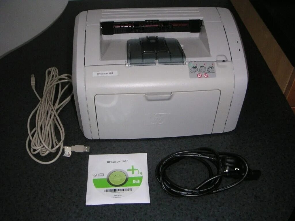 Laserjet 1018 драйвер. HP LASERJET 1018. Принтер HP IJ 1018. Принтер HP LASERJET 1018 кабель. Принтер HP LASERJET 1018 провод для сети.