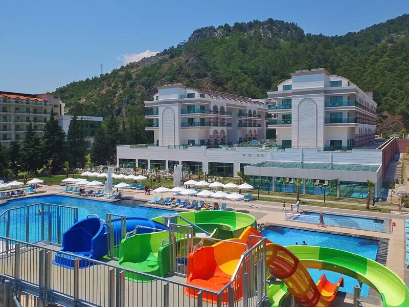 Dosinia luxury resort 5. Турция кемер досиния лакшери резорт 5. Отель досиния кемер. Досиния лакшери резорт кемер пляж. Отель dosinia luxury resort 5.