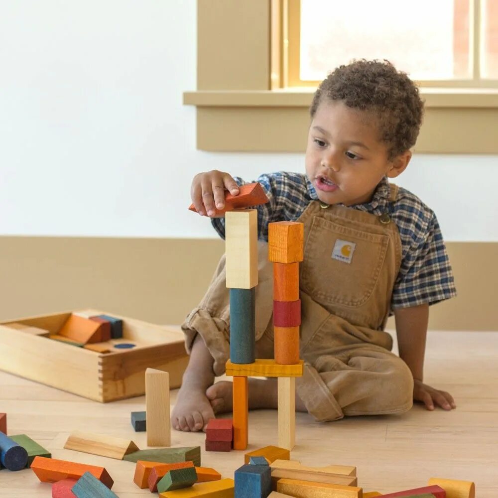 Natural toys. Children playing with Blocks. Child playing with building Blocks. Building Blocks boy. Christmas Gift child playing with building Blocks.