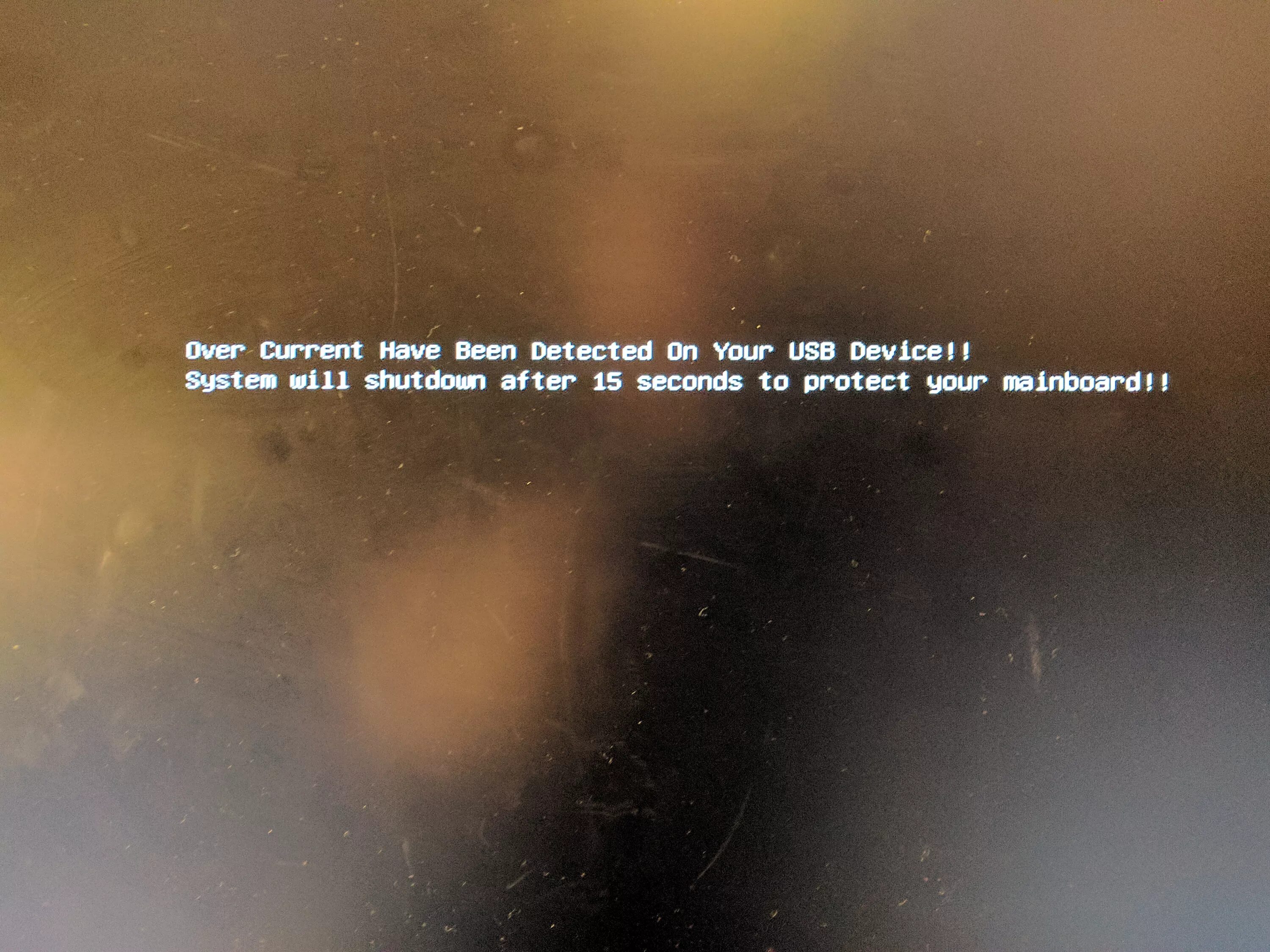 Over current status detected. Over current have been detected on your USB device. USB device over current status detected. USB device over current status detected System will shutdown in 15 seconds. USB over current.