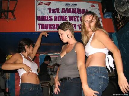 A photo of young girls at a wet t shirt contest in a nightclub. 