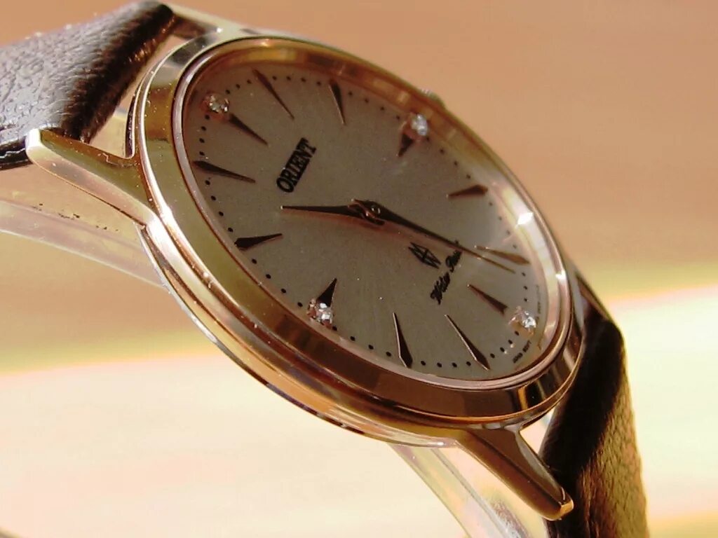 Часы до 20000 рублей. Часы Orient позолоченные. Orient 38 mm позолоченный. Часы Ориент позолоченные. Пурпурные позолоченные часы Orient.