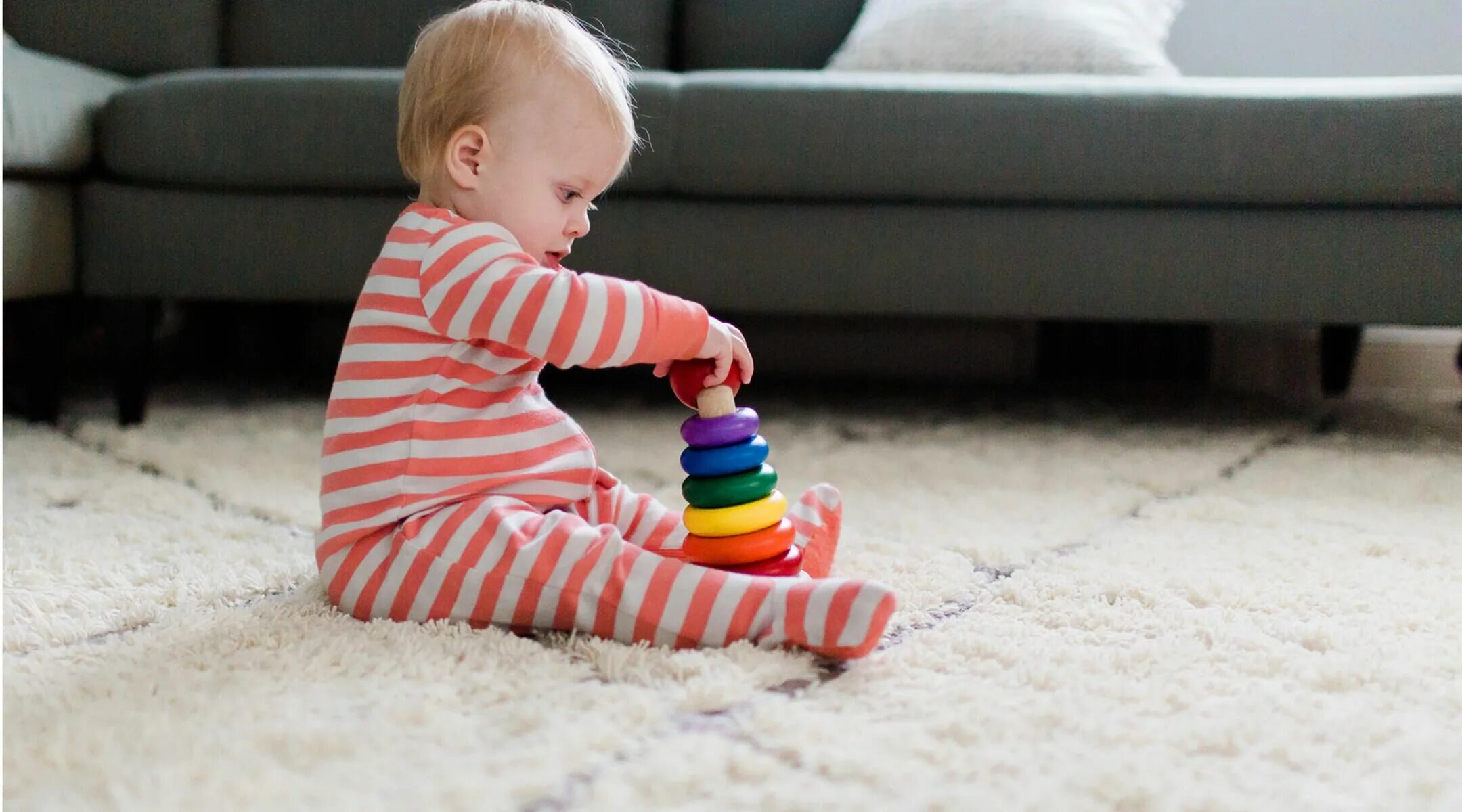 Baby playing with Toys. Child playing with Toys. Cute Baby sitting.